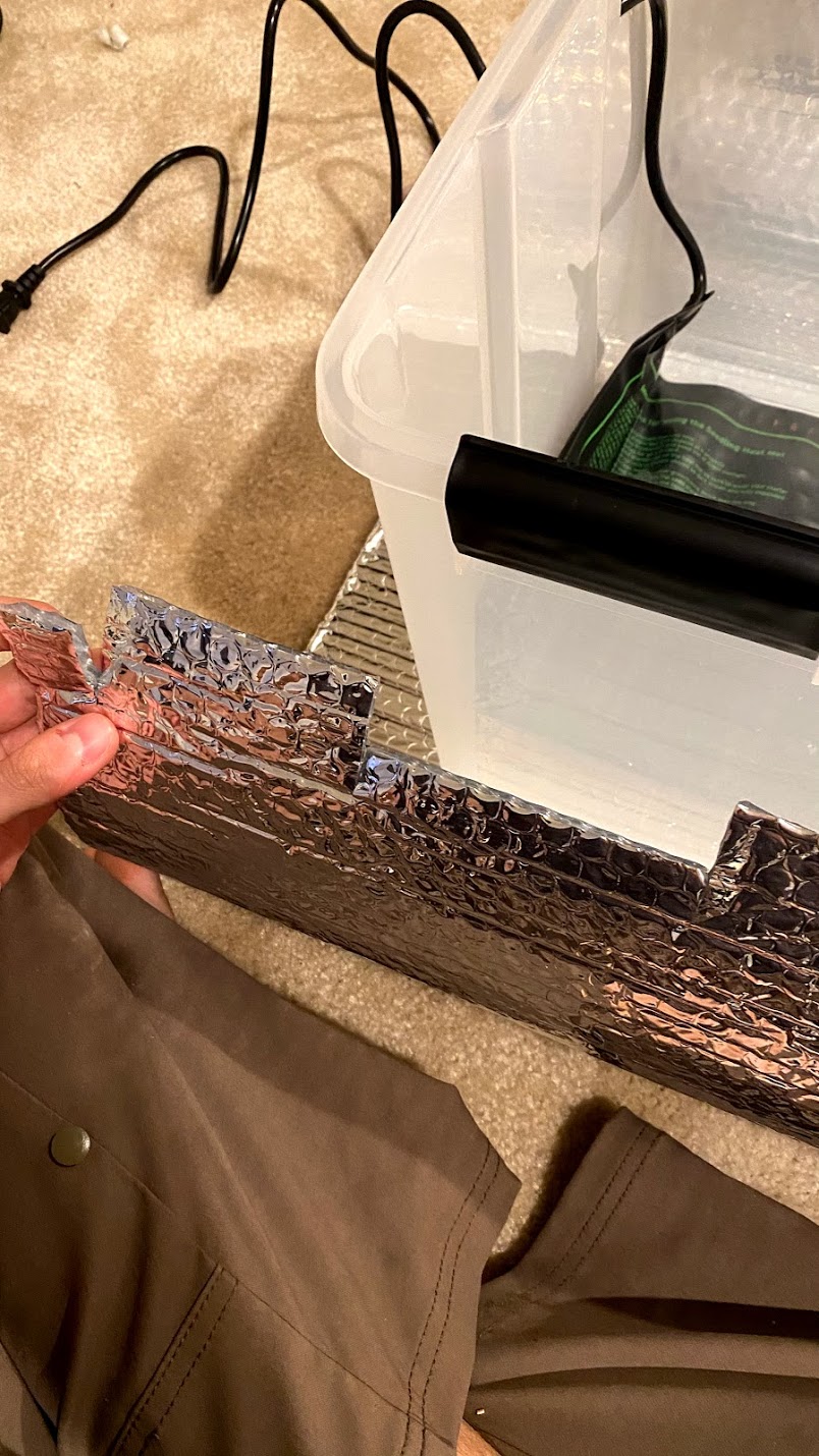 Foil insulation around bin